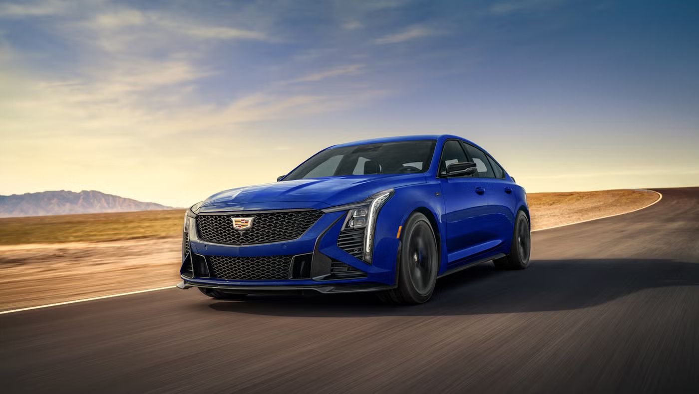 2026 Cadillac CT5-V Blackwing - A blue 2026 Cadillac CT5-V Blackwing Deep Ocean package driving down a winding desert road - Applewood Cadillac - Cadillac new car dealership in Mississauga, Ontario