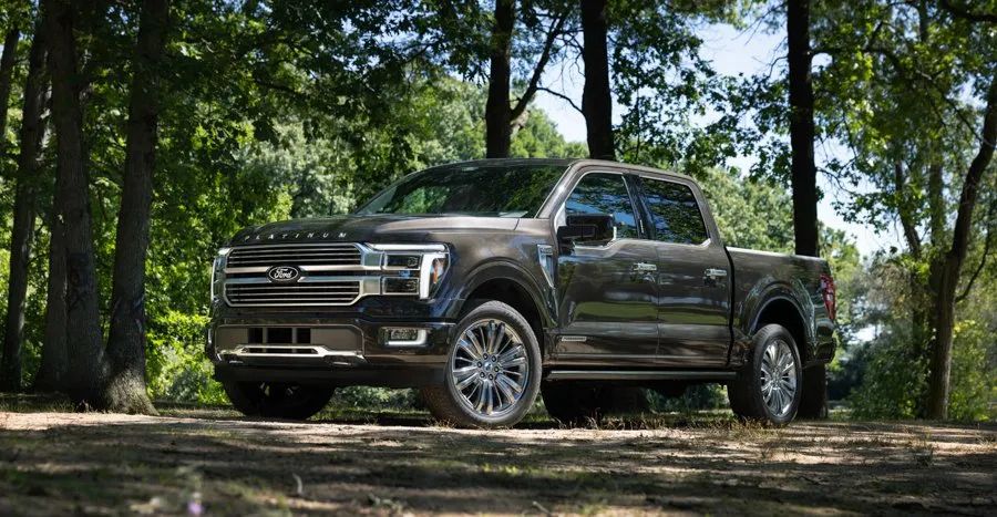 2026 Ford F-150 Platinum - A brown 2026 Ford F-150 Platinum parked in a wooded clearing - Bayfield Ford - New car dealership in Barrie, Ontario