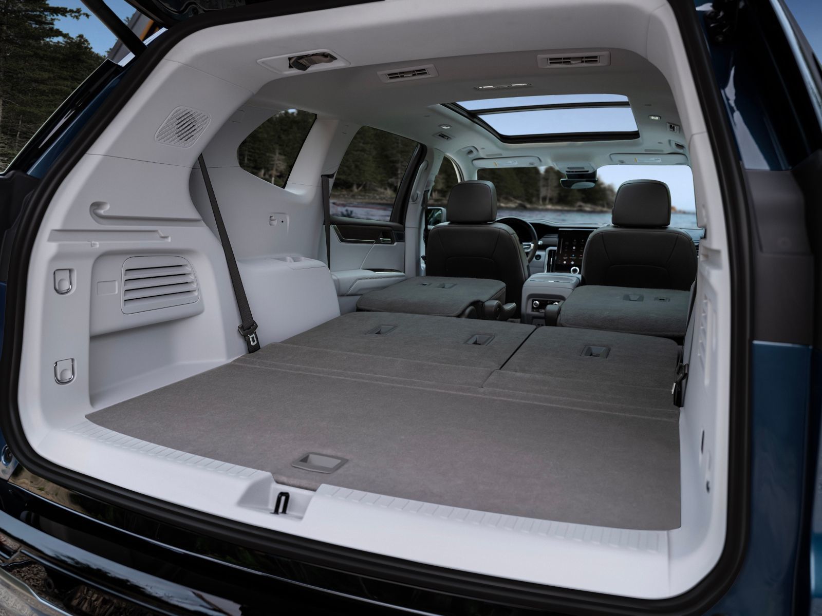 2026 GMC Acadia Denali - Interior view of the open cargo area with rear seats folded down - Applewood Chevrolet, Buick, GMC - New car dealership in Mississauga, Ontario