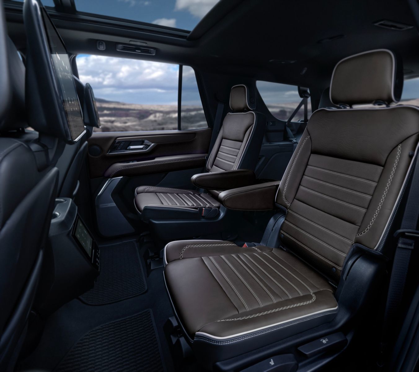 2026 GMC Yukon Denali Ultimate - Interior view of the brown leather second-row captain's chairs - Applewood Chevrolet, Buick, GMC - New car dealership in Mississauga, Ontario