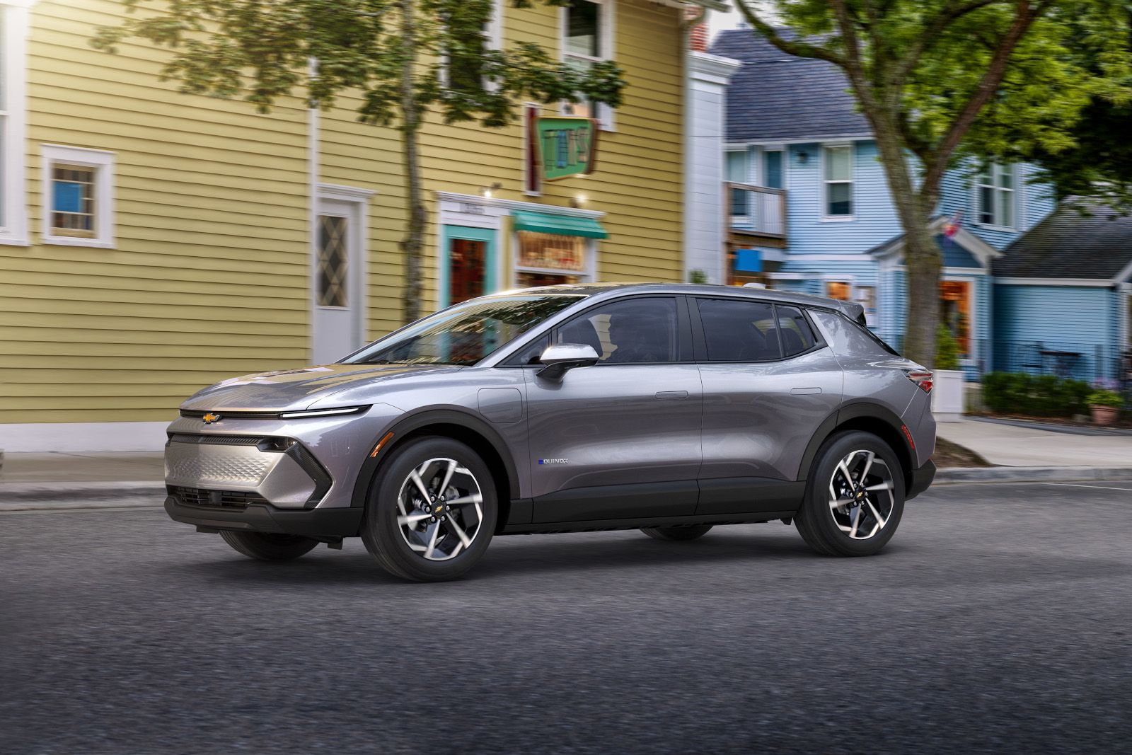 2026 Chevrolet Equinox EV - Front three-quarter view of a silver Chevrolet Equinox EV on a city street - Humberview Group - New car dealerships in Ontario