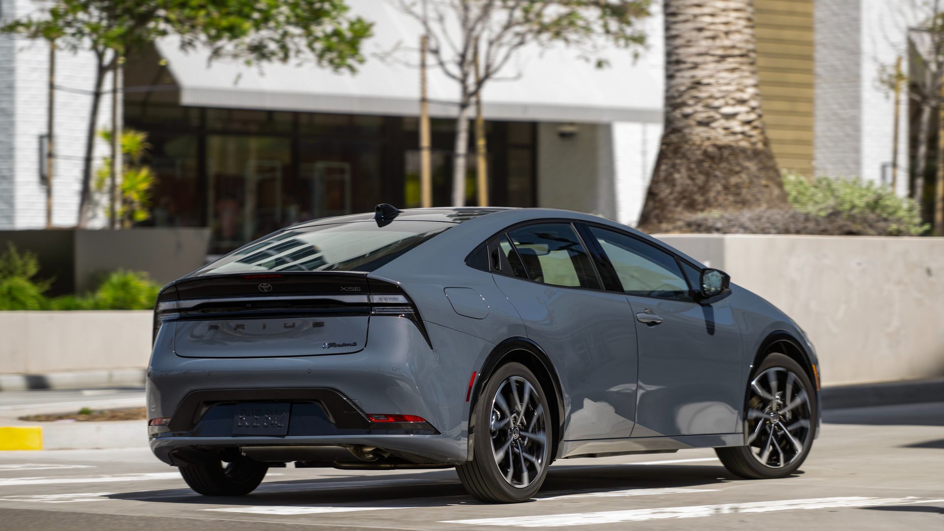 2026 Toyota Prius Prime - rear three-quarter exterior view of a gray 2026 Toyota Prius Prime parked outdoors - Orangeville Toyota - Toyota new car dealership in Orangeville, Ontario