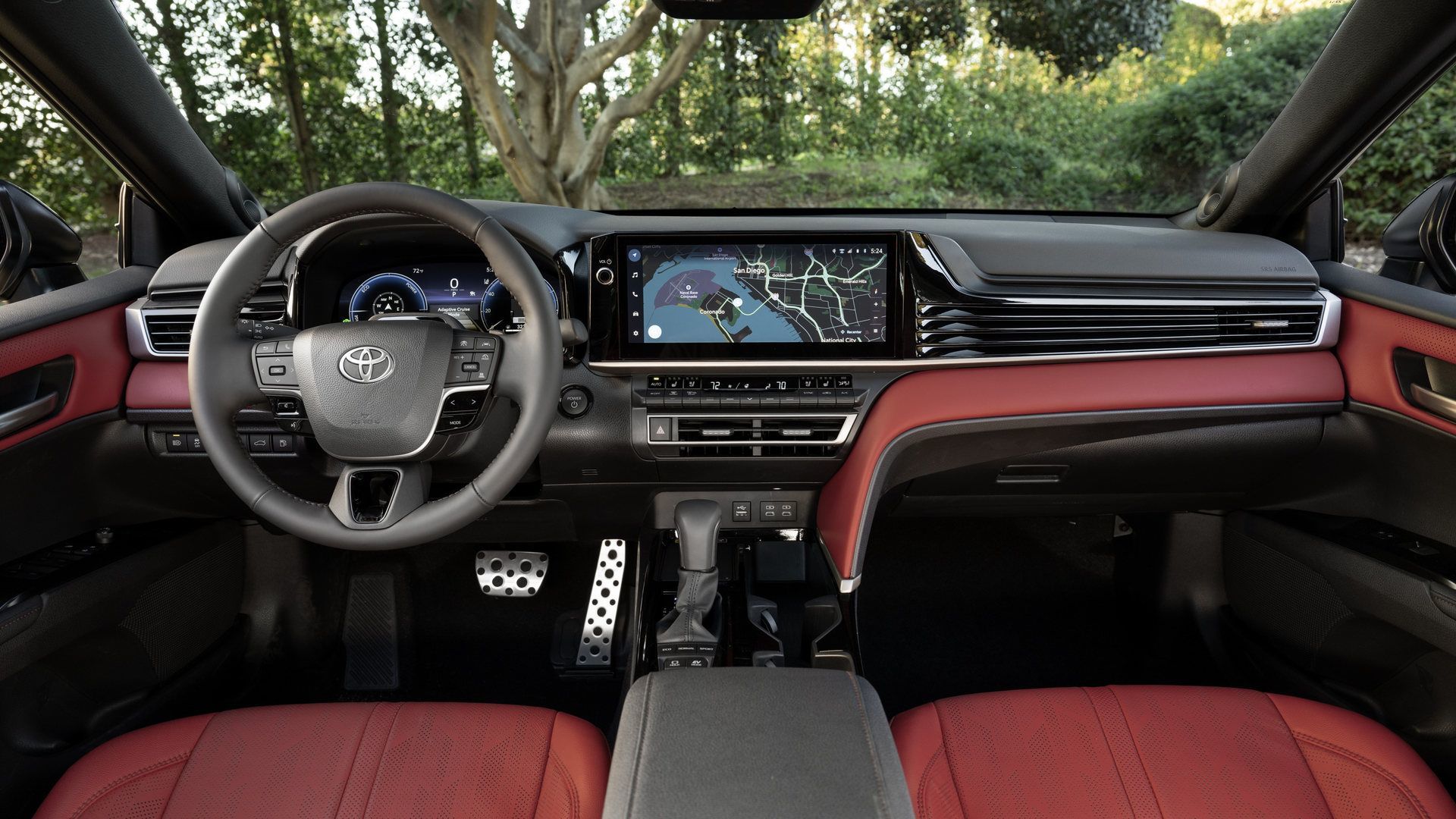 2026 Toyota Camry - interior view of the 2026 Toyota Camry dashboard, steering wheel, and cockpit red leather seats - Orangeville Toyota - Toyota new car dealership in Orangeville, Ontario