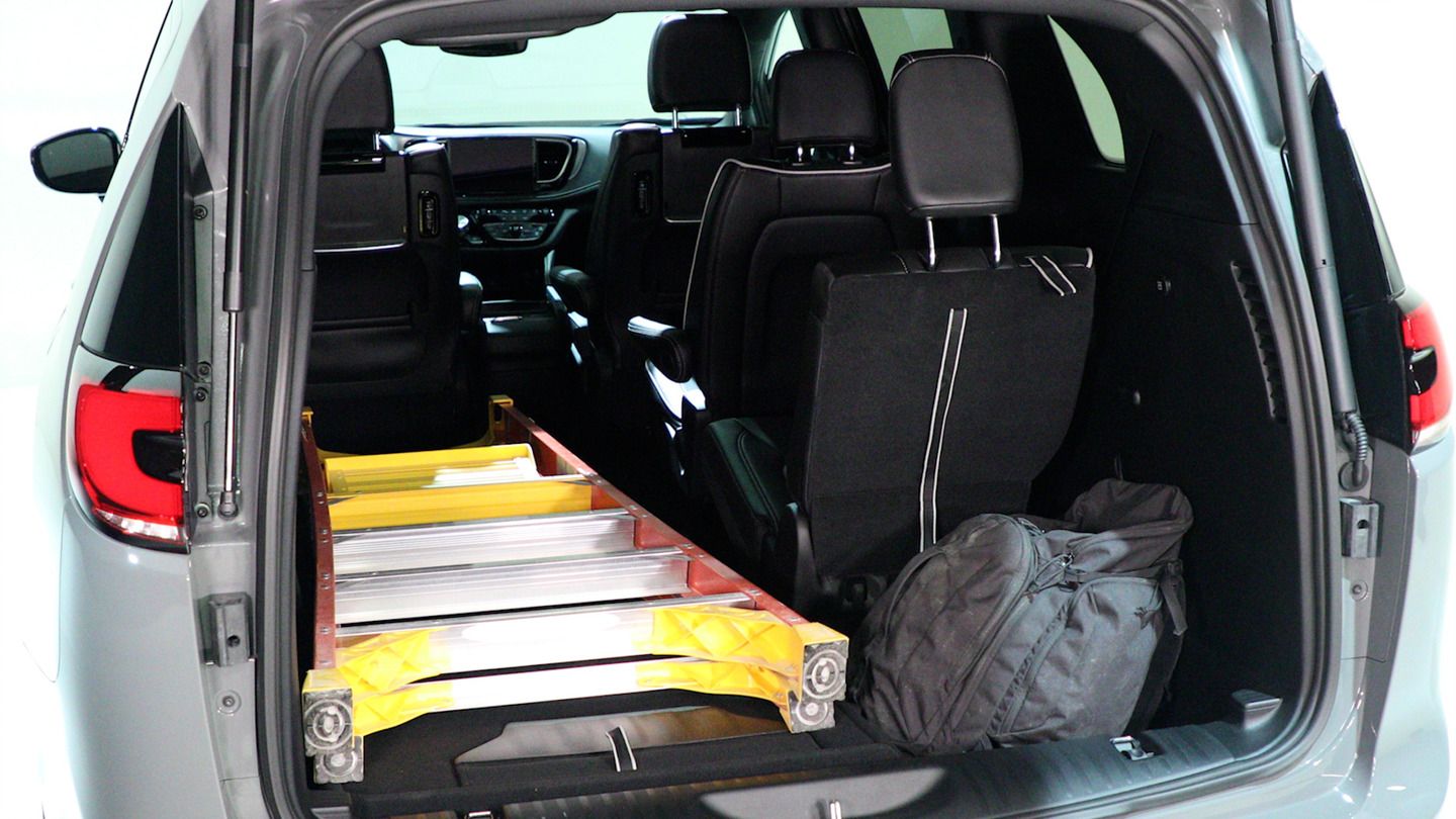 2027 Chrysler Pacifica - rear cargo area of a 2027 Chrysler Pacifica loaded with a ladder and bag - Cooksville Chrysler, Jeep, Dodge, RAM - Chrysler new car dealership in Mississauga, Ontario