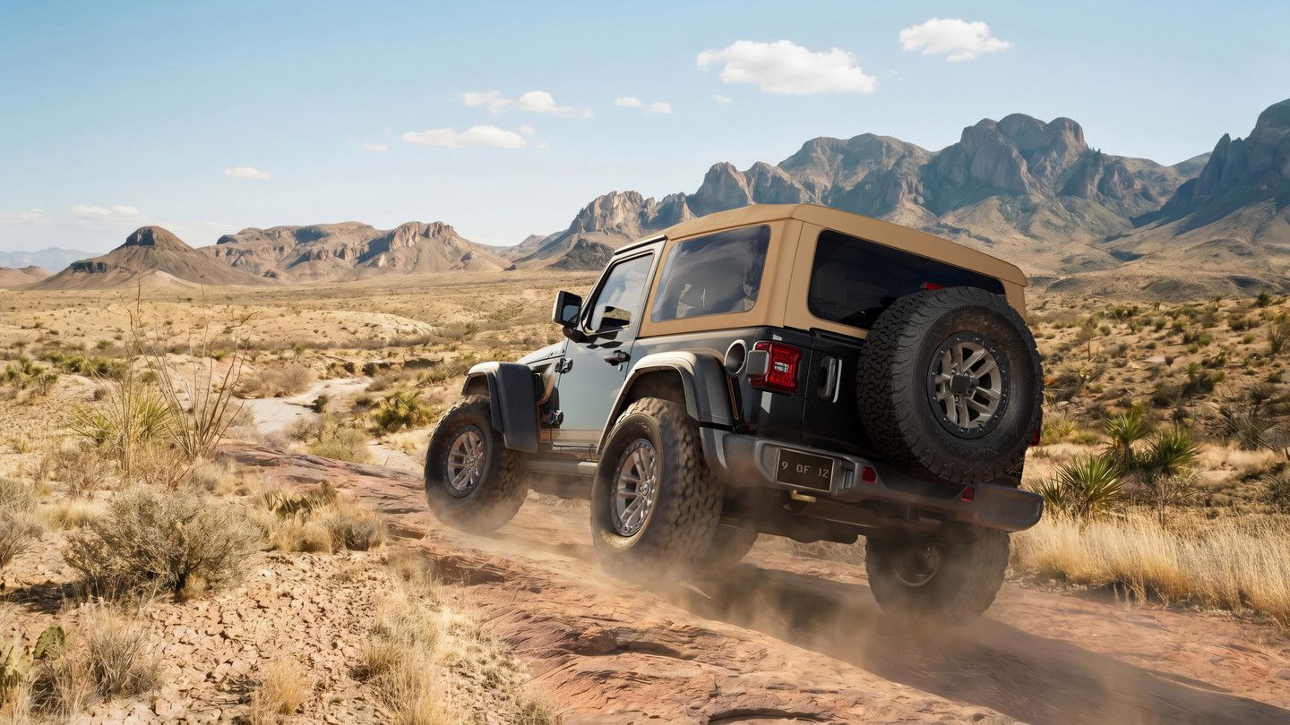 2027 Jeep Wrangler - low angle view of a white 2027 Jeep Wrangler parked in a gravel pit - Cooksville Chrysler, Jeep, Dodge, RAM - Jeep new car dealership in Mississauga, Ontario