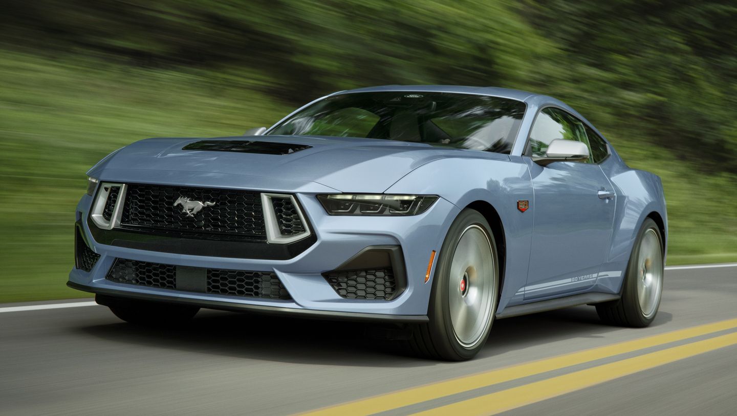 2026 Ford Mustang - a light blue 2026 Ford Mustang driving on a paved road - Mayfield Ford - Ford new car dealership in Brampton, Ontario
