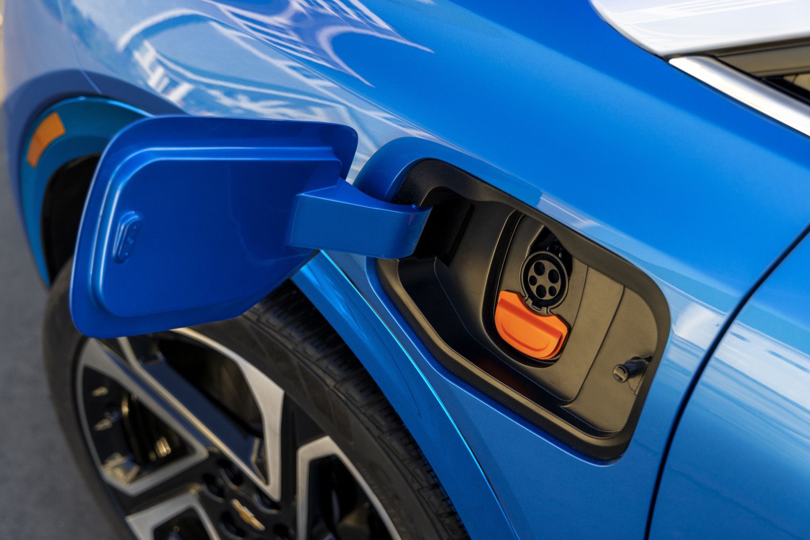 2026 Chevrolet Equinox EV - close-up of the charging port and wheel on a blue 2026 Chevrolet Equinox EV - Humberview Chevrolet, Buick, GMC - Chevrolet car dealership in Toronto, Ontario