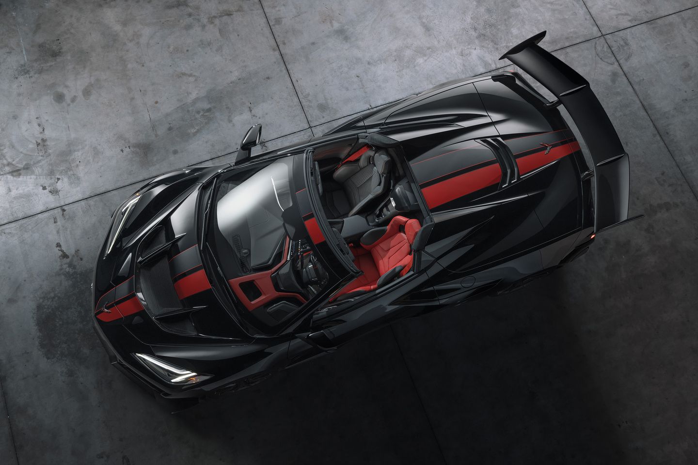 2026 Chevrolet Corvette ZR1 - aerial top-down view of a black 2026 Chevrolet Corvette ZR1 convertible with red racing stripes and interior - Humberview Group - Chevrolet new car dealerships in Ontario