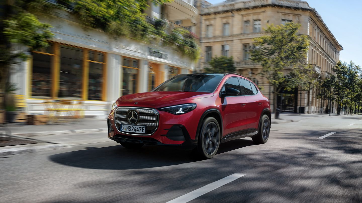 2028 Mercedes-Benz GLA - a front three-quarter view of a red 2028 Mercedes-Benz GLA driving on a city street - Mercedes-Benz Brampton - New car dealership in Brampton, Ontario