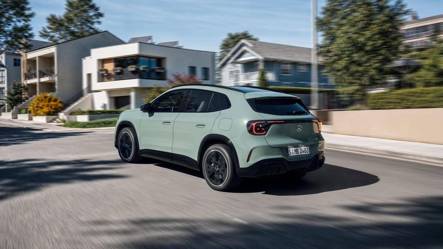 2028 Mercedes-Benz GLA - a rear three-quarter view of a sage green 2028 Mercedes-Benz GLA driving on a residential street - Mercedes-Benz Brampton - New car dealership in Brampton,