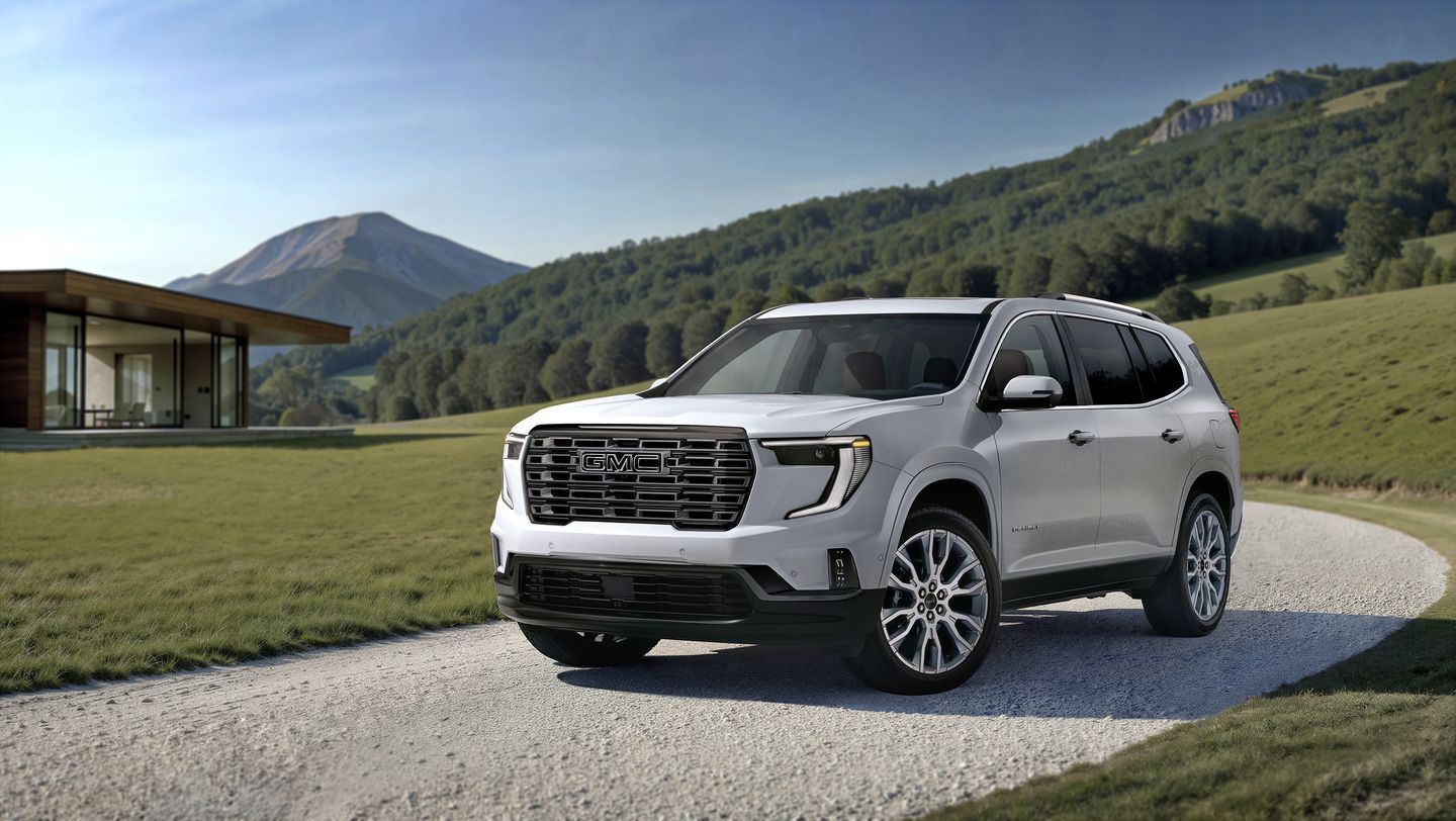 2026 GMC Acadia - front three-quarter view of a white 2026 GMC Acadia Denali parked on a gravel driveway - City Chevrolet, Buick, GMC - GMC car dealership in Toronto, Ontario
