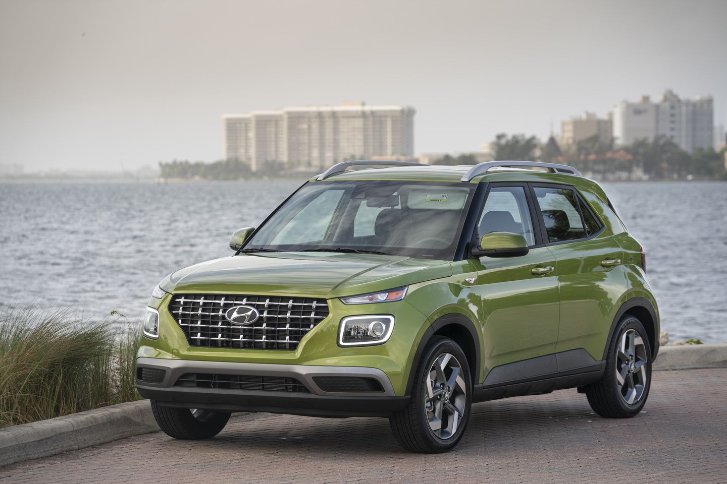 2026 Hyundai Venue - a green 2026 Hyundai Venue parked on a paved lot overlooking the water - Humberview Group - New car dealerships in Ontario