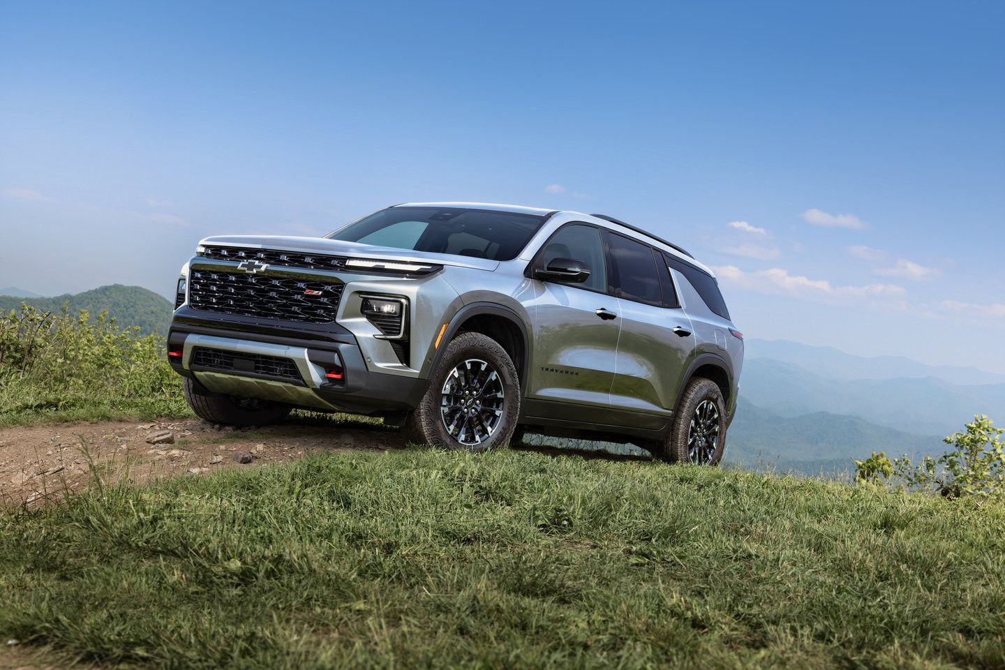 2026 Chevrolet Traverse - a light silver-blue 2026 Chevrolet Traverse Z71 parked on a grassy hilltop trail - Humberview Group - New car dealerships in Ontario
