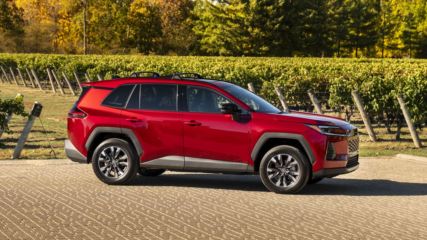 2026 Toyota RAV4 - side view of a red 2026 Toyota RAV4 parked in front of a vineyard - Oakville Toyota - Toyota car dealership in Oakville, Ontario