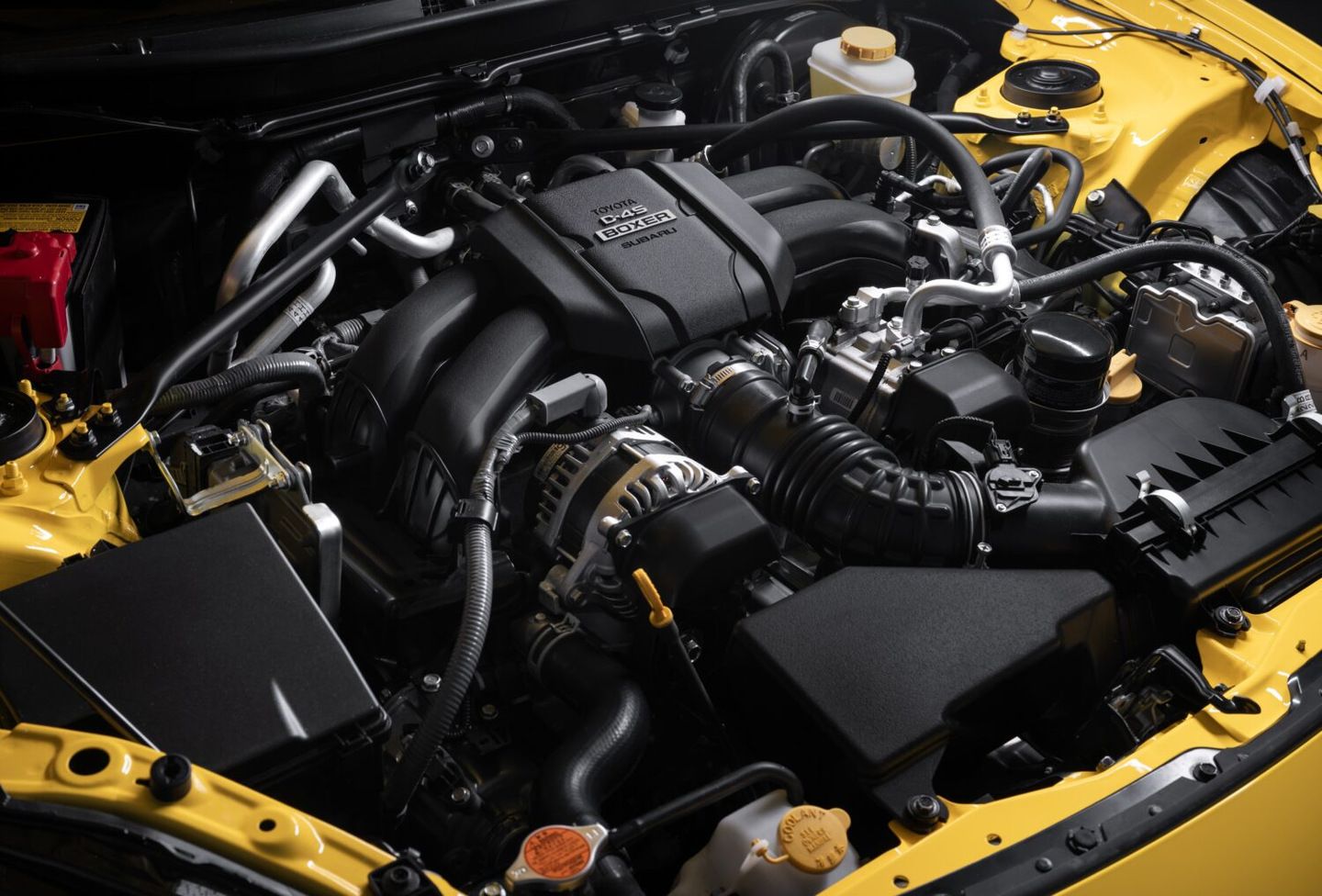 2026 Toyota GR86 - close-up view of the Boxer engine bay in a yellow 2026 Toyota GR86 - Goderich Toyota - Toyota new car dealership in Goderich, Ontario