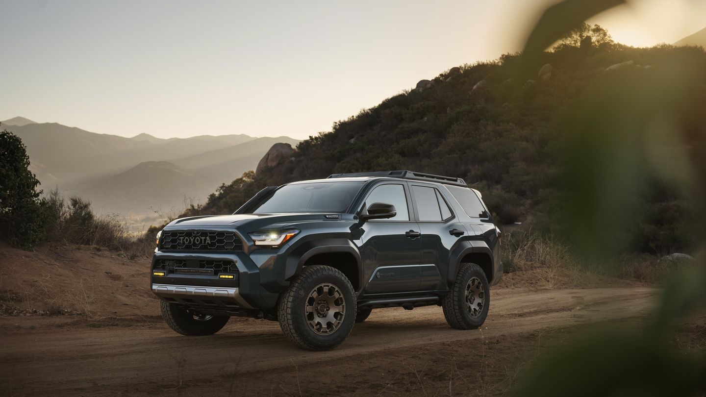 2026 Toyota 4Runner - a dark green 2026 Toyota 4Runner Trailhunter driving on a trail in the mountains - Georgetown Toyota - Toyota car dealership in Georgetown, Ontario