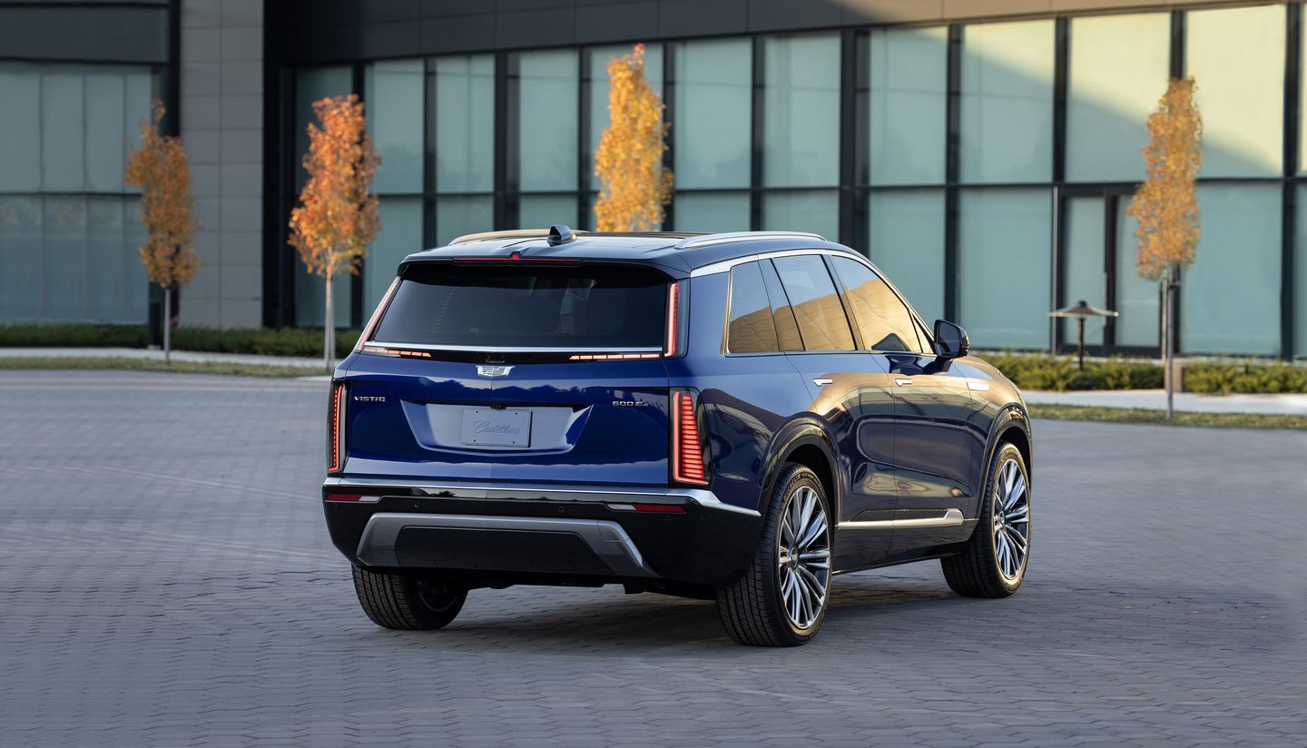 2026 Cadillac Vistiq - rear three-quarter view of a blue 2026 Cadillac Vistiq parked outdoors - Applewood Cadillac - Cadillac new car dealership in Mississauga, Ontario