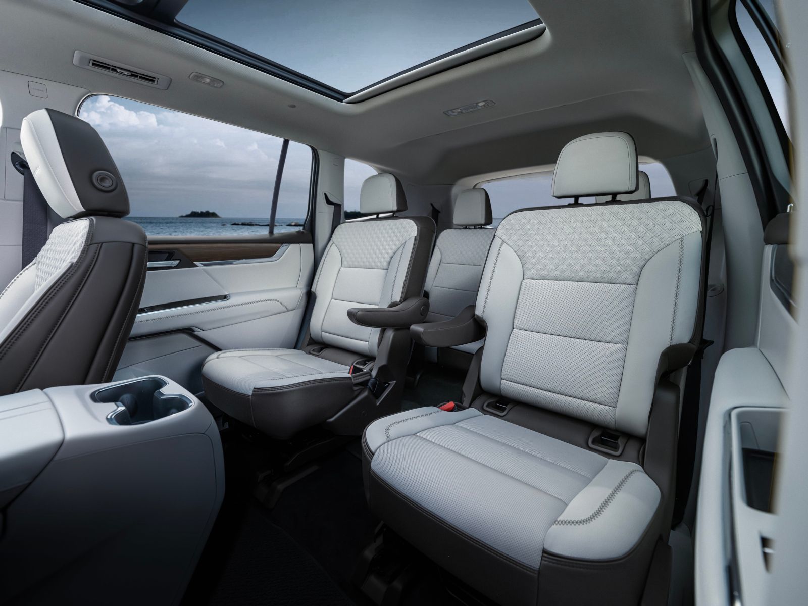 2026 GMC Acadia - interior view of the 2026 GMC Acadia second-row leather captain's chairs and panoramic sunroof - Applewood Chevrolet, Buick, GMC - GMC new car dealership in Mississauga, Ontario