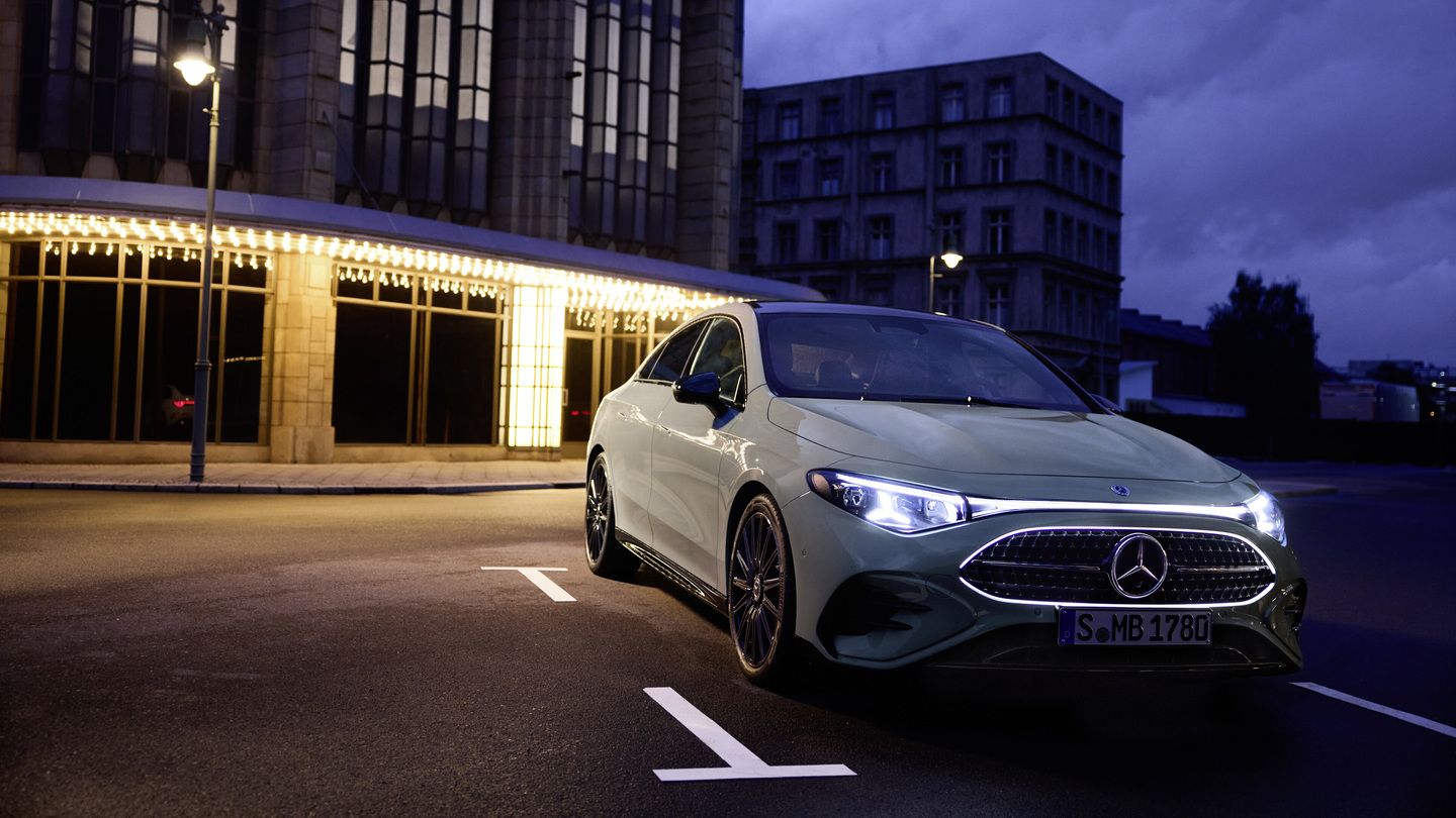 2027 Mercedes-Benz CLA - front three-quarter view of a light green 2027 Mercedes-Benz CLA parked in front of an illuminated building at night - Humberview Group - New car dealerships in Ontario