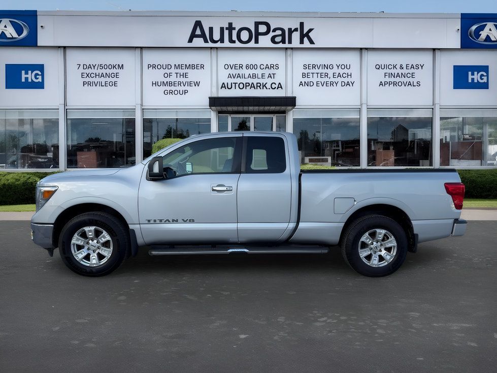 Nissan Titan - side profile view of a silver Nissan Titan pickup truck - AutoPark Brampton - Used car dealership in Brampton, Ontario