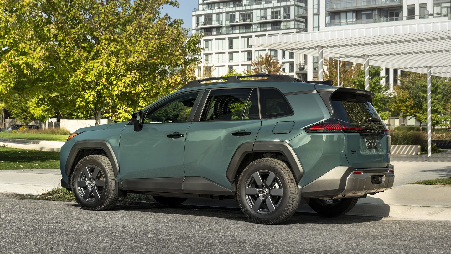 2027 Toyota RAV4 - side rear angle of a green 2027 Toyota RAV4 parked on a paved street - Georgetown Toyota - Toyota car dealership in Georgetown, Ontario