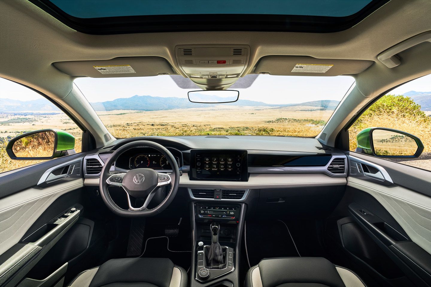 2027 Volkswagen Taos - interior view of the dashboard, steering wheel, and infotainment display - Humberview Volkswagen - Volkswagen new car dealership in Toronto, Ontario