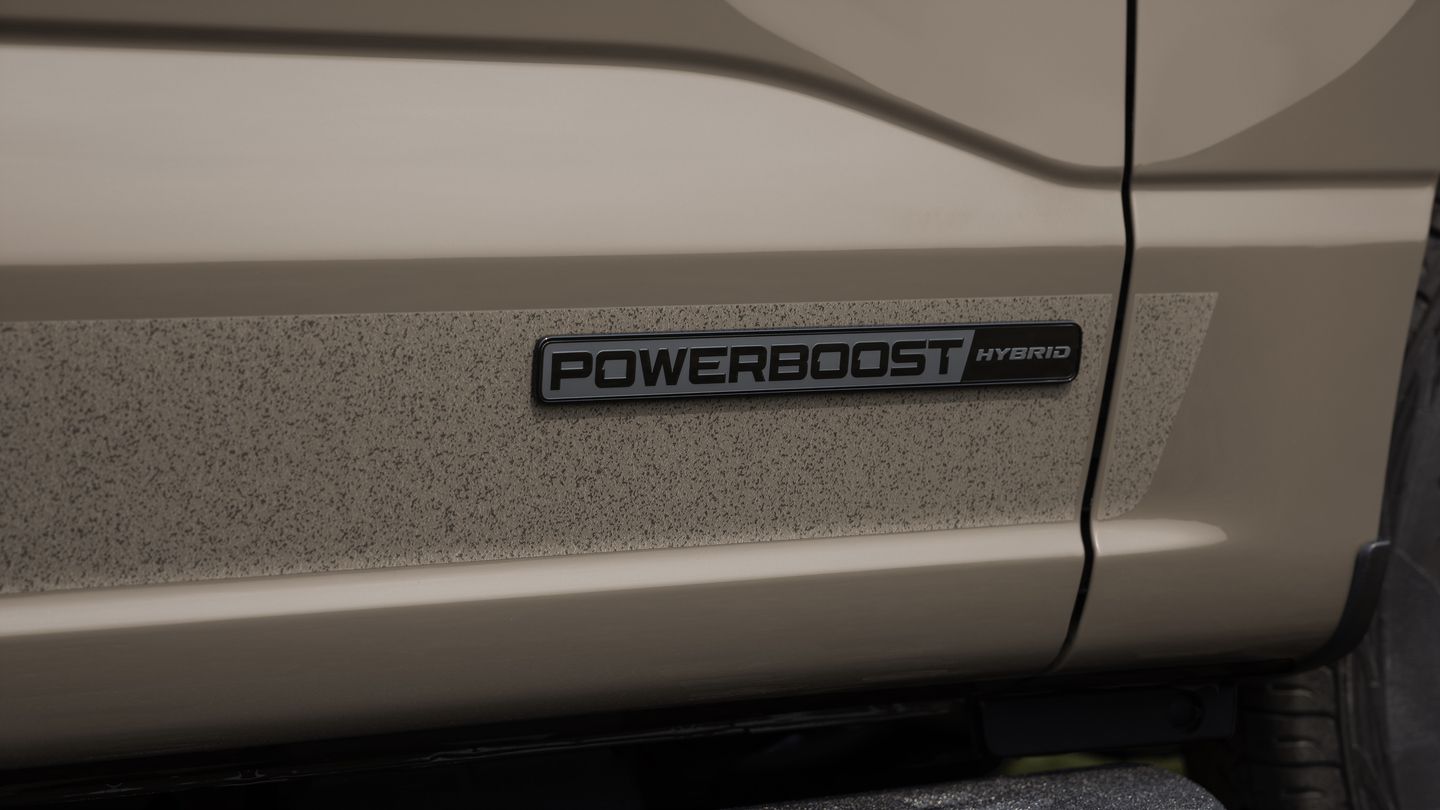 2027 Ford F-150 - close-up of the 2027 Ford F-150 PowerBoost Hybrid door badge - Bayfield Ford - Ford new car dealership in Barrie, Ontario