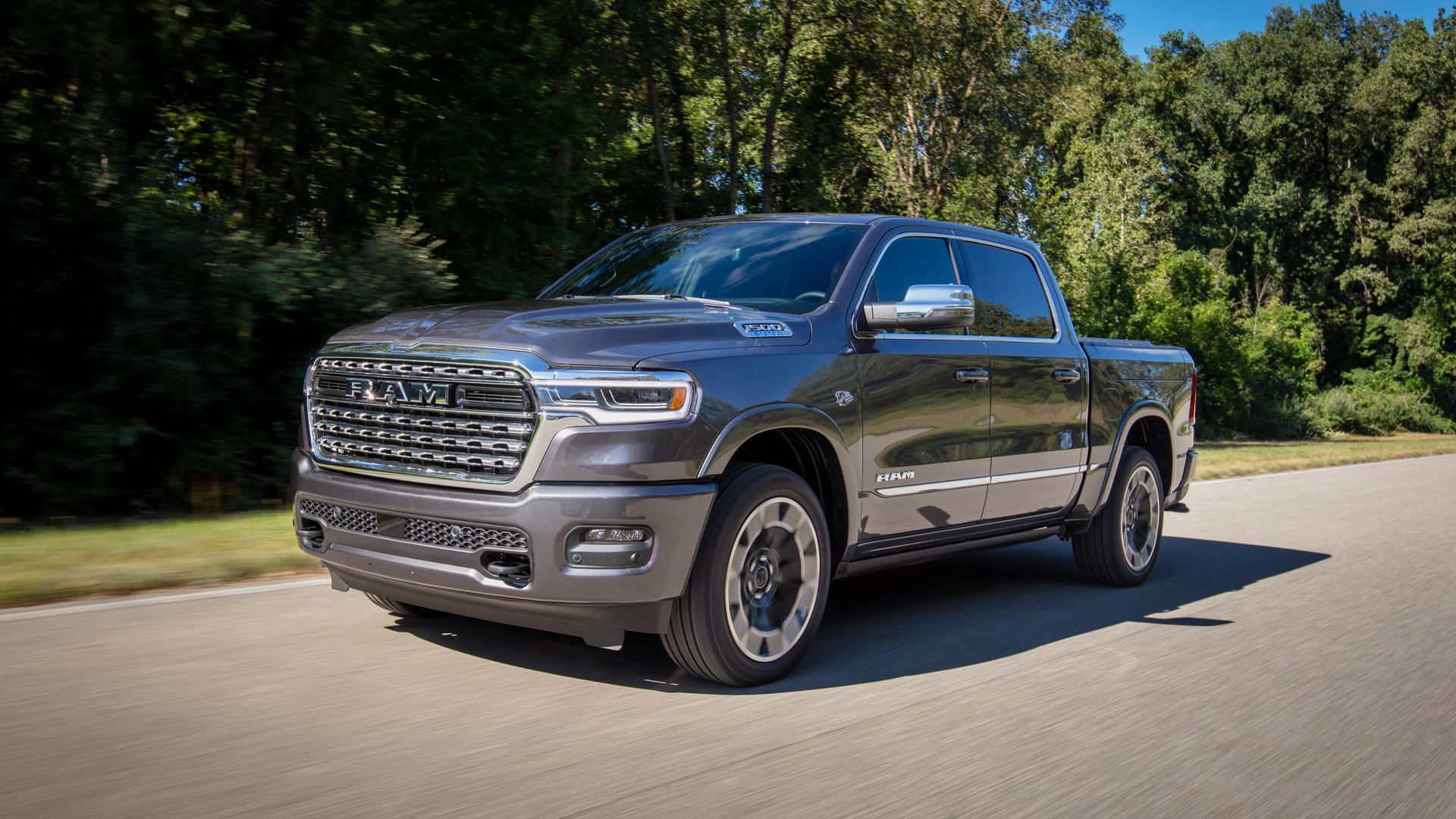 2027 Ram 1500 - a dark grey 2027 Ram 1500 driving on a paved road - Cooksville Chrysler, Jeep, Dodge, Ram - New car dealership in Mississauga, Ontario