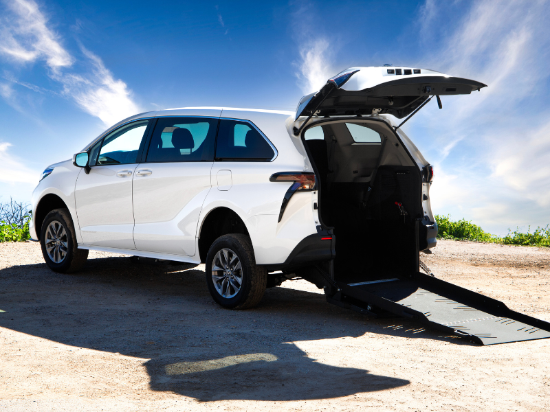 2027 Toyota Sienna - Rear three-quarter view of a white 2027 Toyota Sienna with open rear hatch and wheelchair ramp deployed - Humberview Mobility - Accessible car dealership in Toronto, Ontario
