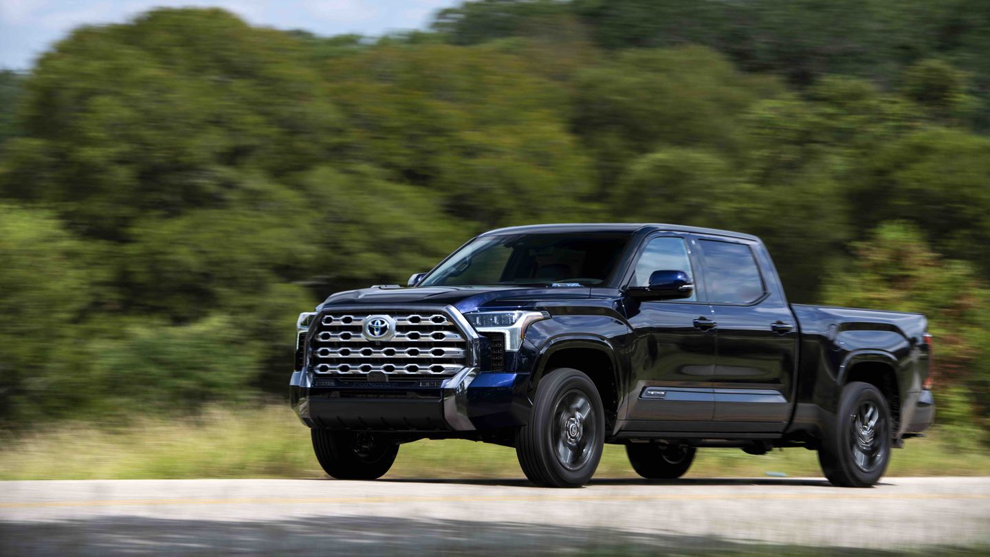 2027 Toyota Tundra - front three-quarter view of a dark blue 2027 Toyota Tundra driving on a road - Humberview Group - New car dealerships in Ontario