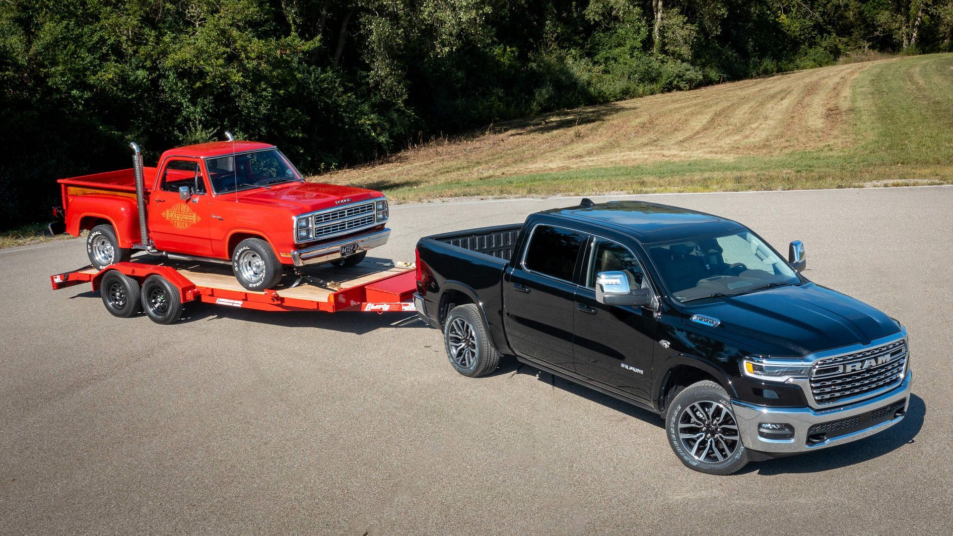 2027 Ram 1500 - black 2027 Ram 1500 towing a red vintage truck on a trailer - Humberview Group - New car dealerships in Ontario