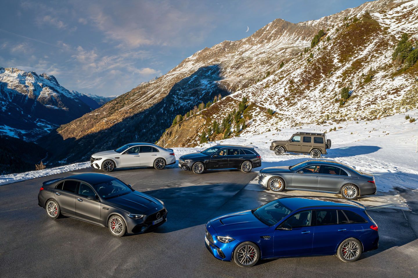 Mercedes-Benz Lineup - lineup of Mercedes-Benz vehicles parked on a scenic snowy mountain overlook - Mercedes-Benz Brampton - New car dealership in Brampton, Ontario