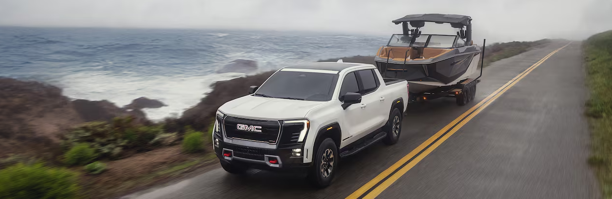 Electric pickup. Sierra EV 2026. GMC Sierra AT4. 4x4 truck. Extended range. Fast charging. Towing capacity. Off-road vehicle. Advanced technology. GMC electric truck. Premium comfort. Rugged design. Luxury interior. Touchscreen display. Driver assistance. High-capacity battery. Sept-Îles GMC. 2026 electric truck. Electric GMC AT4. Sierra 2026 Quebec.