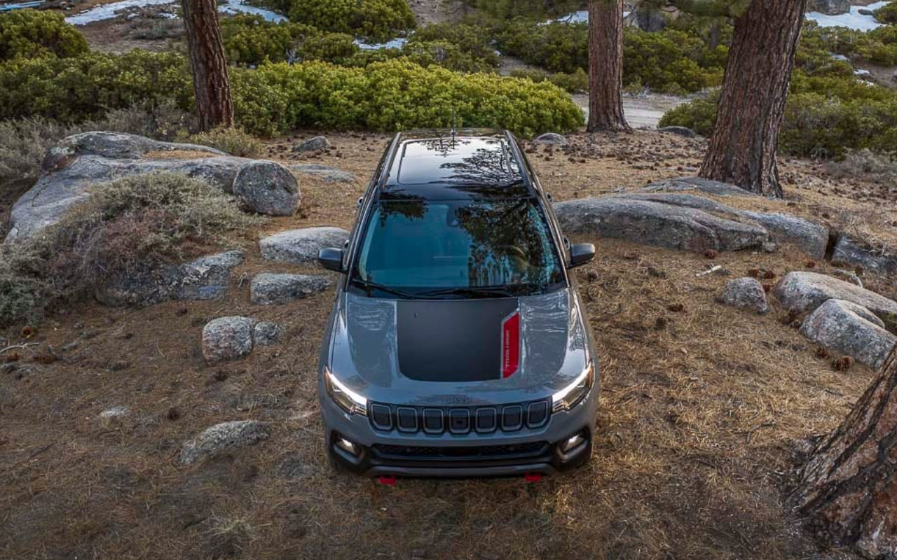 raised frontal view of a 2022 Jeep Compass in a forest