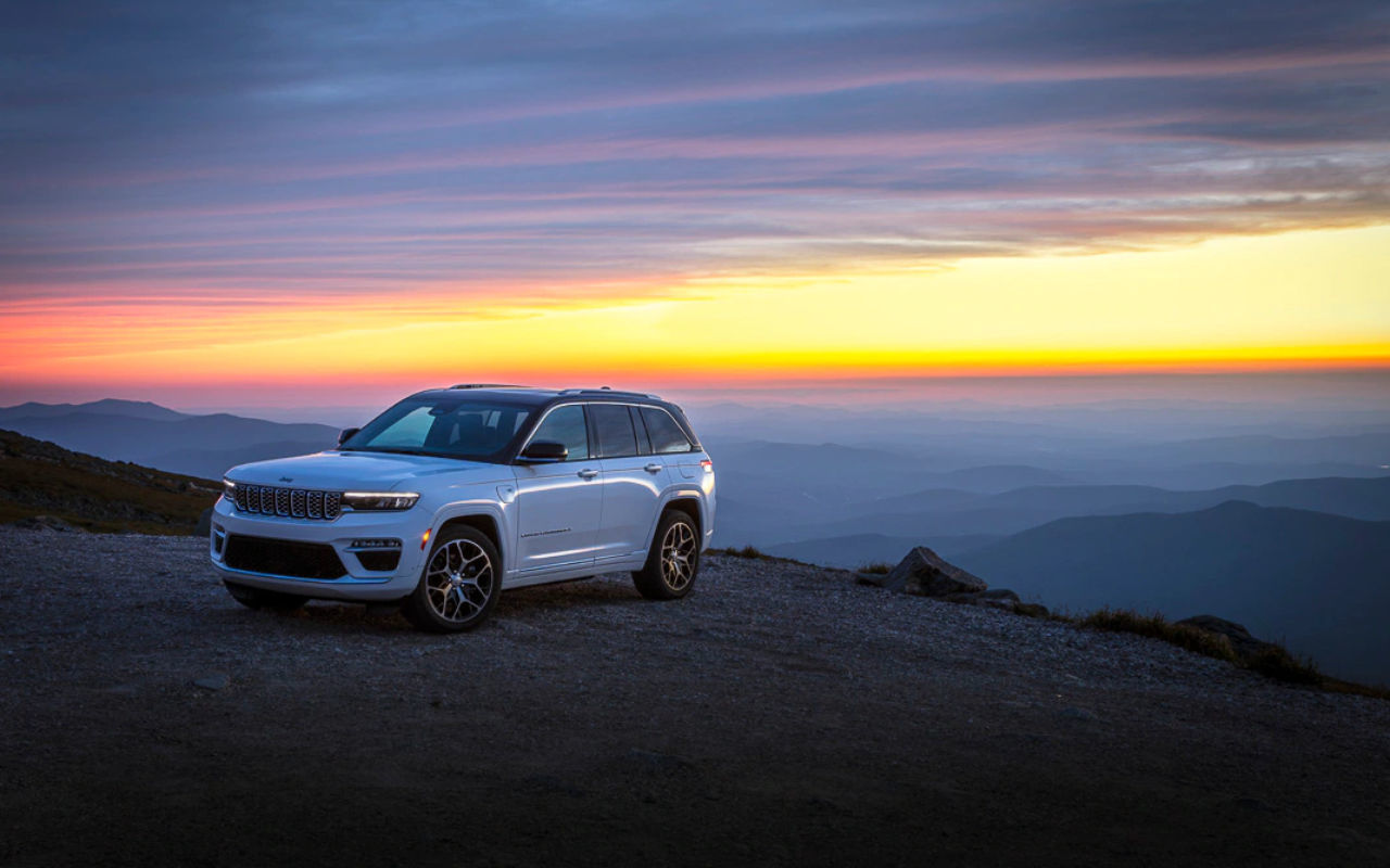 2022 Jeep Grand Cherokee on a mountaintop at sunset