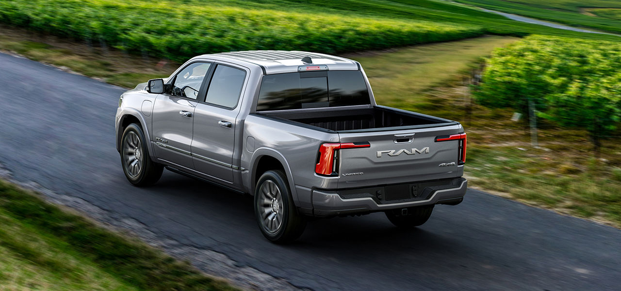 Rear view of the RAM 1500 2025 on a country road