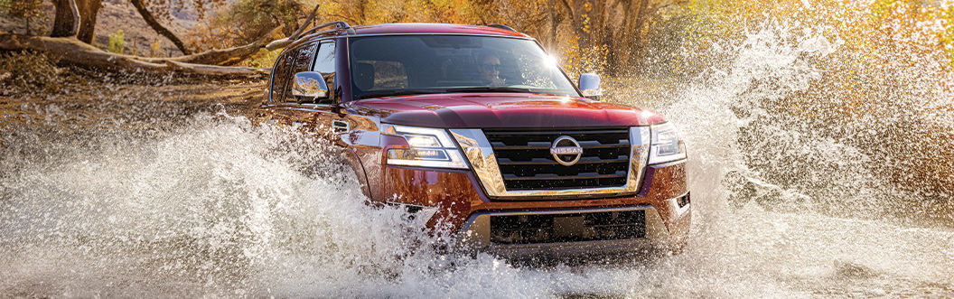 2021 Nissan Armada - Performance red 2021 Nissan Armada driving through water