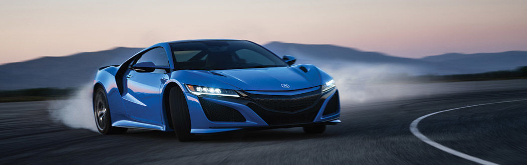 blue 2021 acura nsx drifting on race track