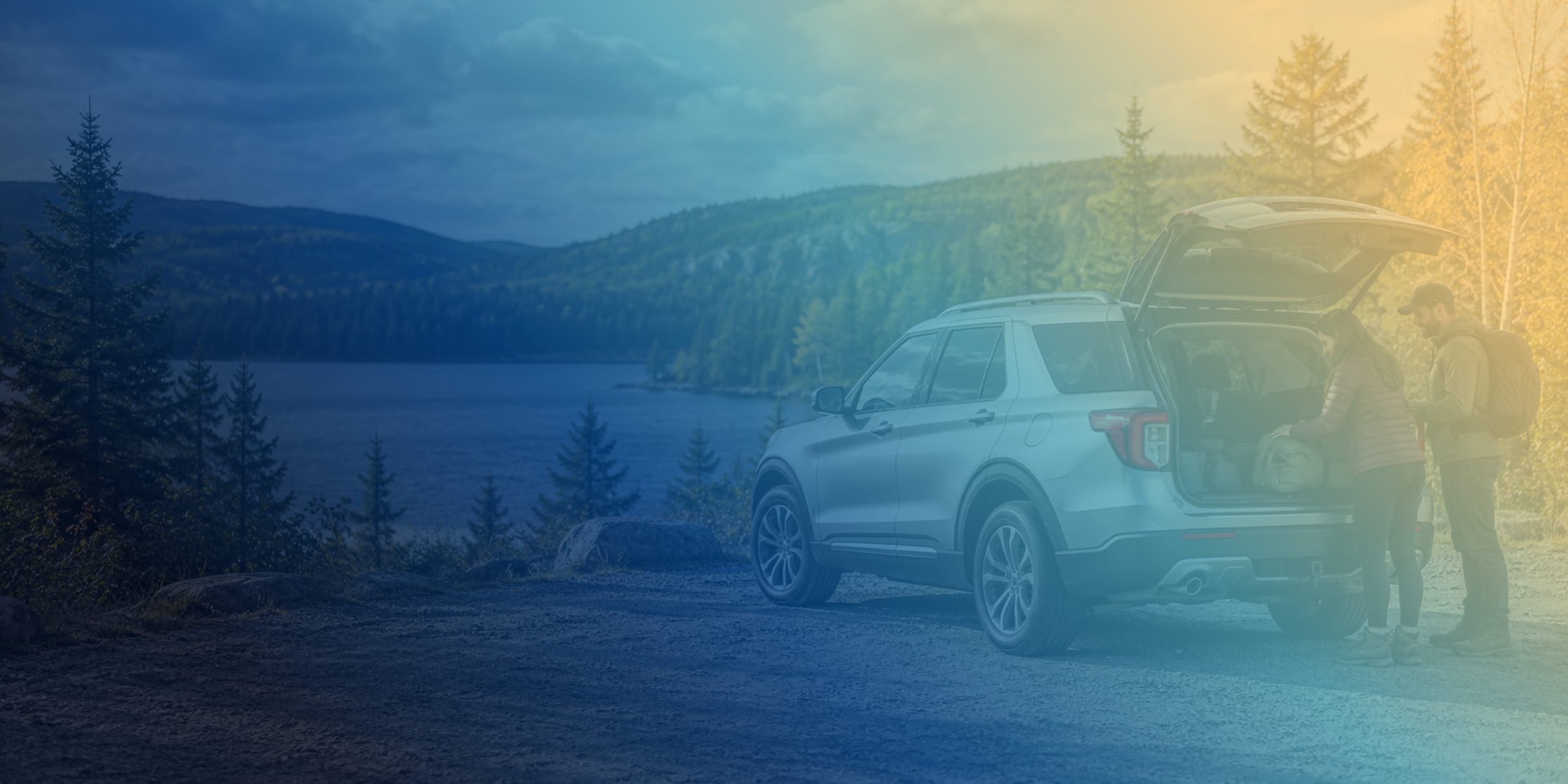 Illustrative scene of two people loading an SUV beside a lake.