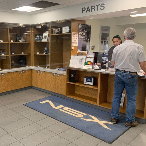 Parts Team Member At Acura Pickering Helps A Customer