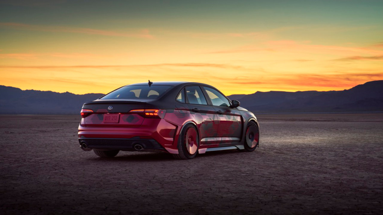 rear side view of a 2023 VW Jetta GLI in a desert at sunset