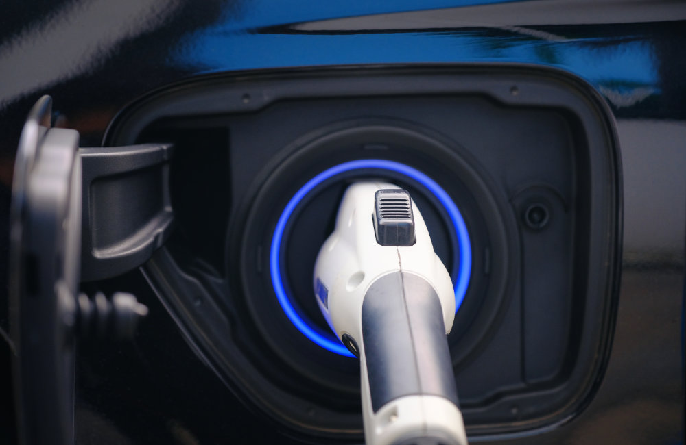 close up of a plugged-in charger on an electric vehicle