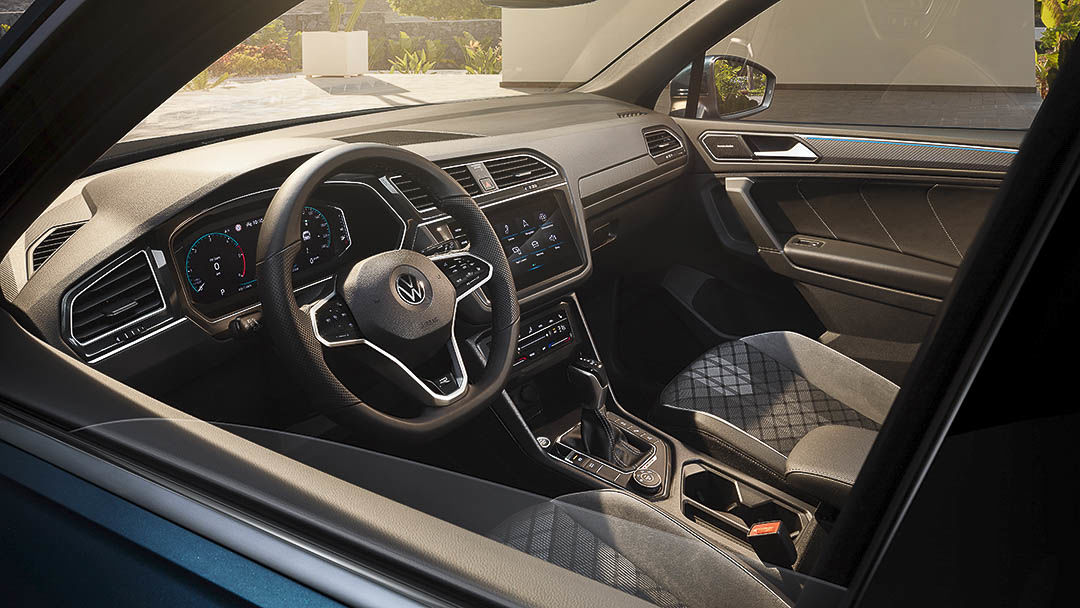 inside view of the 2021 Volkswagen Tiguan showing the front row seats and the driving wheel