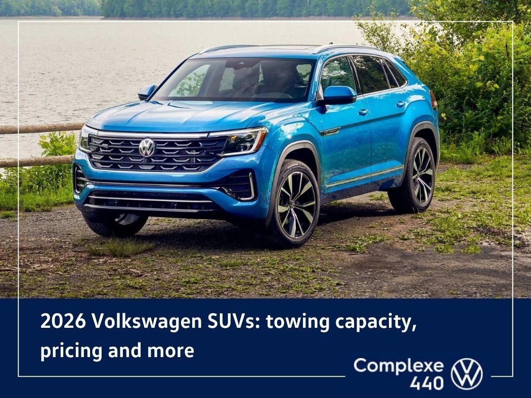 Volkswagen SUV towing a trailer on a paved road