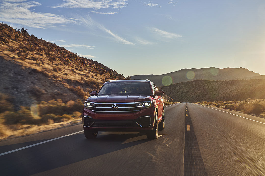 front view of the 2021 Volkswagen Atlas Cross Sport driving down a road