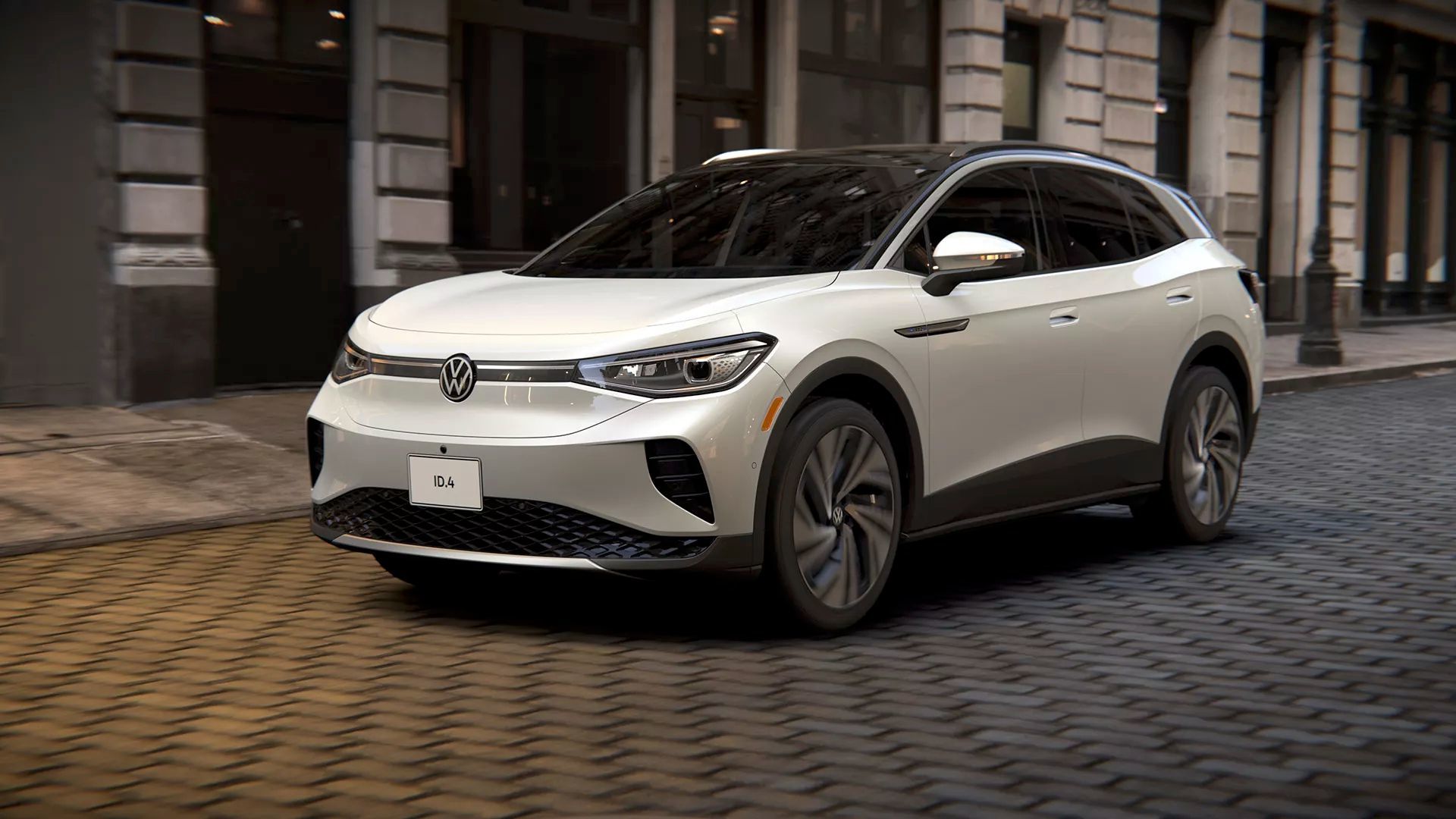 The Volkswagen iD.4 parked overnight on a cobbled road in the city.