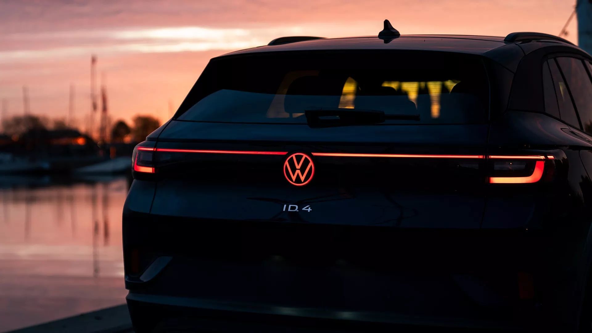 Close-up rear view of Volkswagen ID.4 with the light on at sunset.