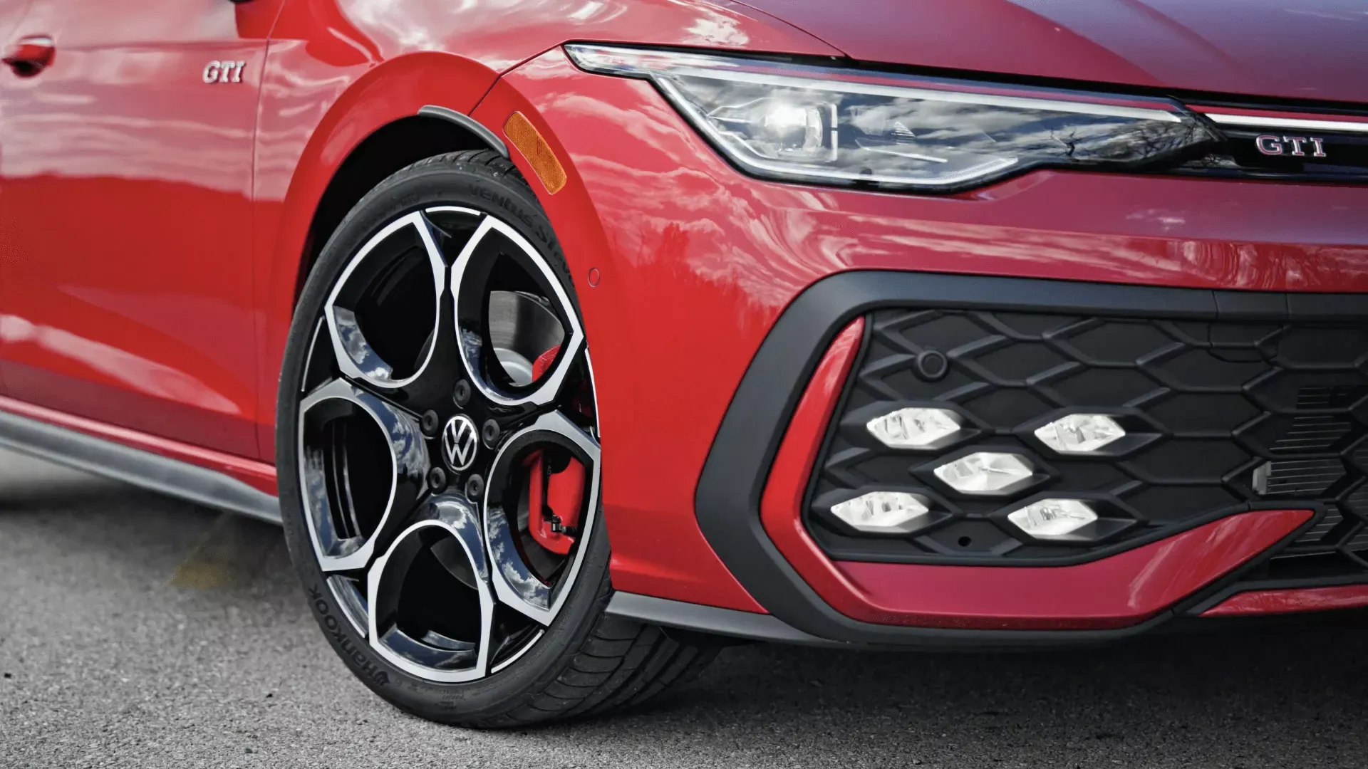 Front details of the red 2026 Volkswagen Golf GTI.