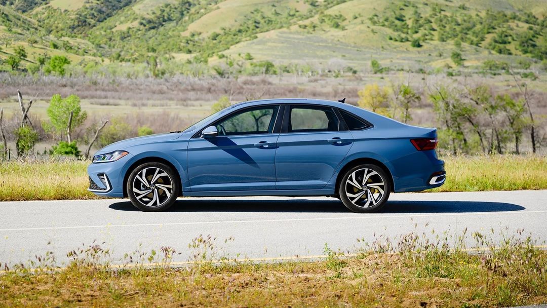 Side view of 2025 Jetta parked on a road.