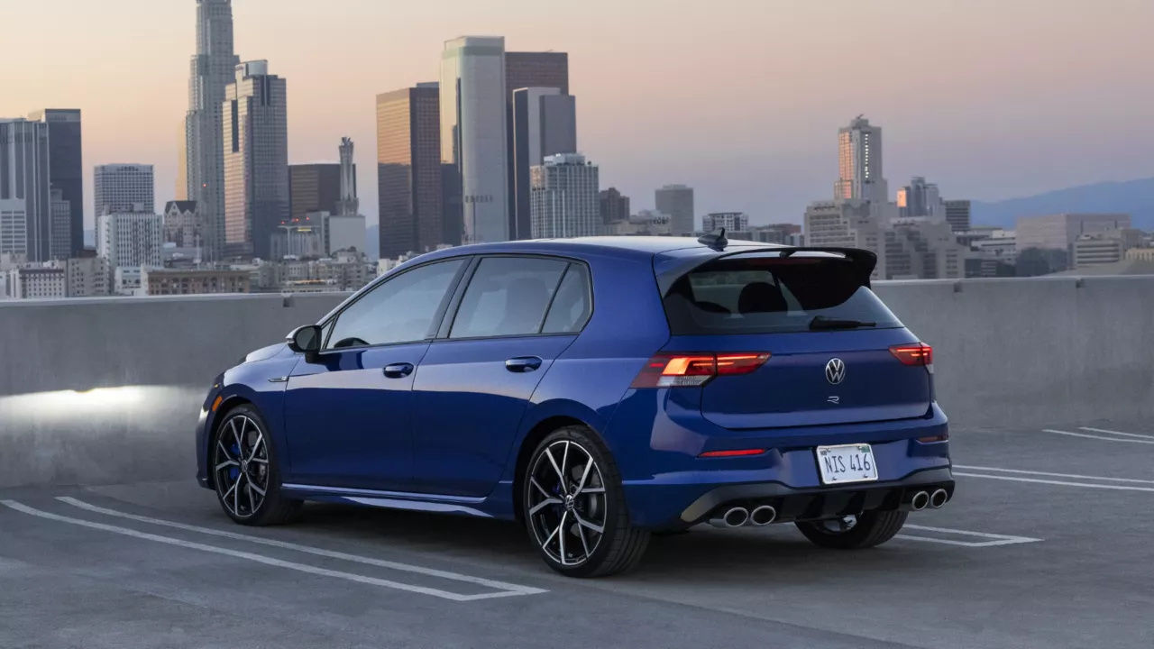 Rear 3/4 view of Volkswagen Golf R in a parking lot.